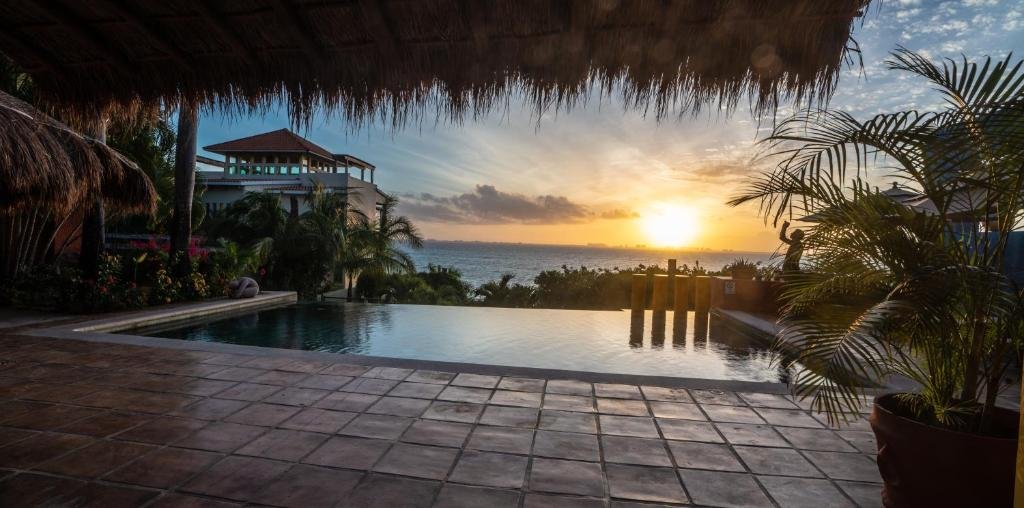 Casa de los Suenos clifftop infinity pool overlooking Caribbean Sea Isla Mujeres Mexico