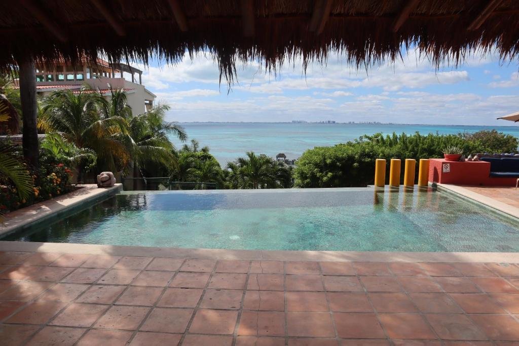 Casa de los Suenos clifftop infinity pool overlooking Caribbean Sea Isla Mujeres Mexico