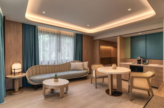 Dusit Thani Krabi two tier infinity pool cascading to white sand beach Thailand