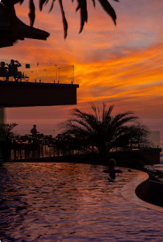 Hotel Boutique Lagarta Lodge infinity pool Pacific Ocean jungle canopy view Nosara Costa Rica