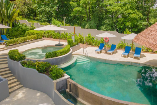 Hotel Boutique Lagarta Lodge infinity pool Pacific Ocean jungle canopy view Nosara Costa Rica